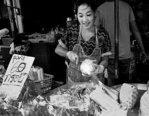 Pineapple woman Thai market photo by Tord Remme